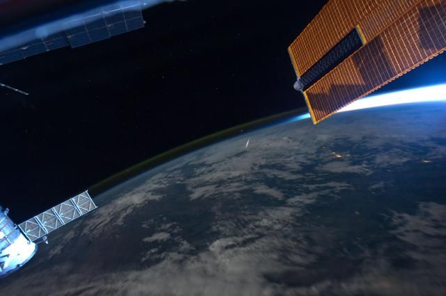 A meteor heads toward Earth as seen from the ISS