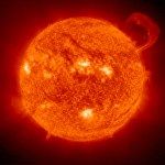 Tendrils of hot plasma stream from the Sun.