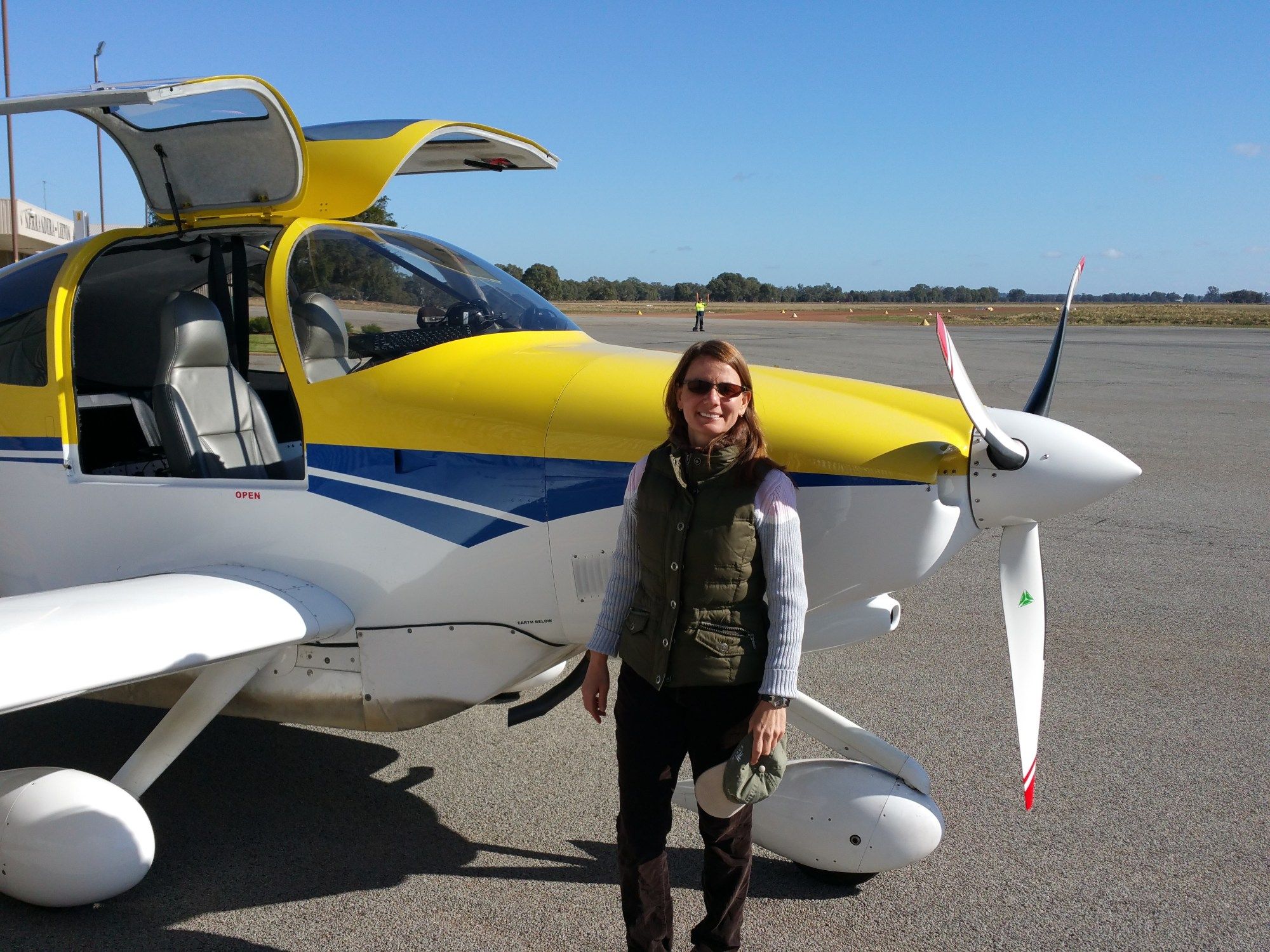 At a Soil Moisture Active Passive (SMAP) campaign in Australia, posing in front of an aircraft that collected measurements in support of the calibration/validation activities. Credit: Erika Podest