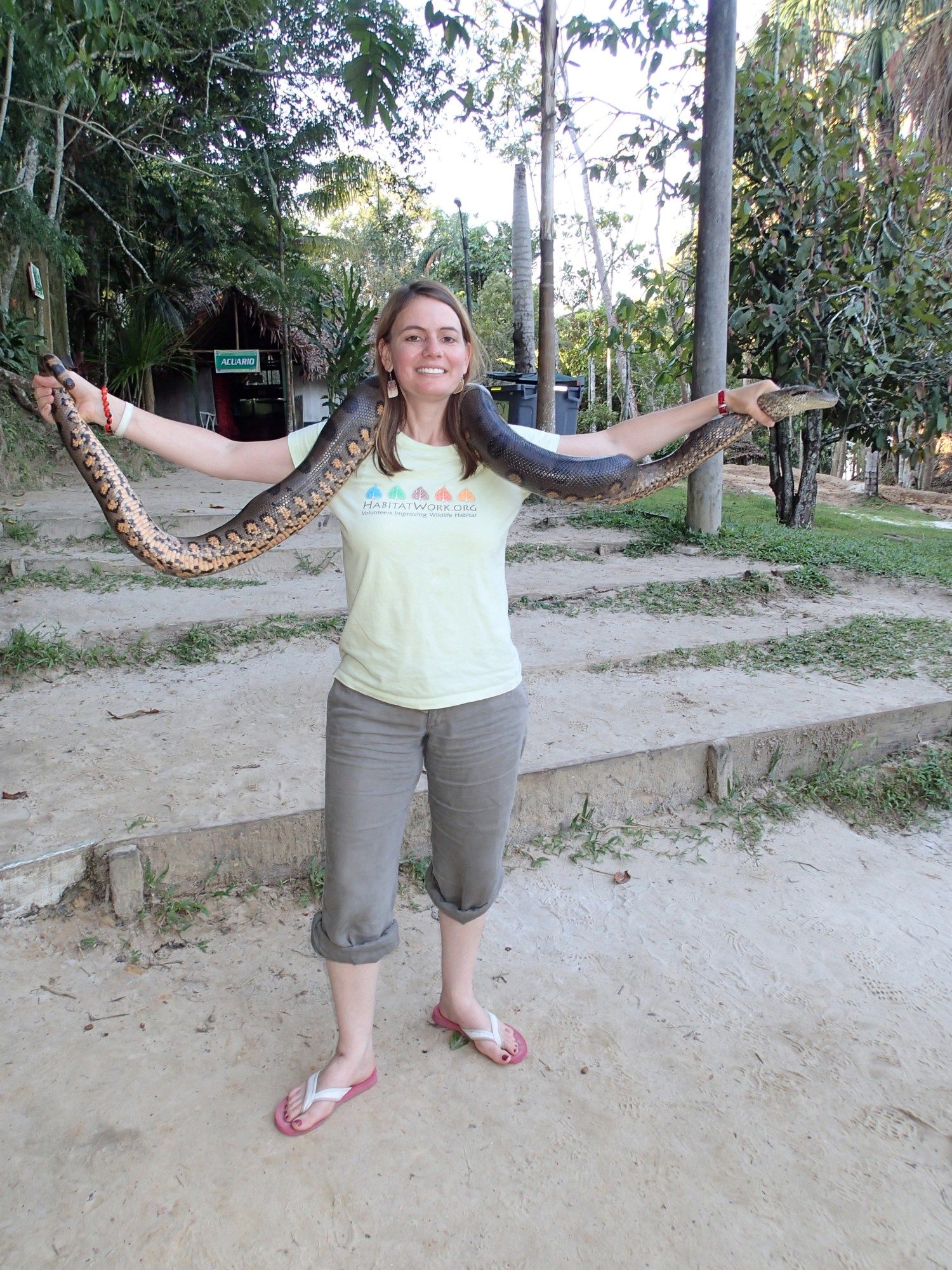Posing with an Anaconda in the Peruvian Amazon. Credit: Erika Podest