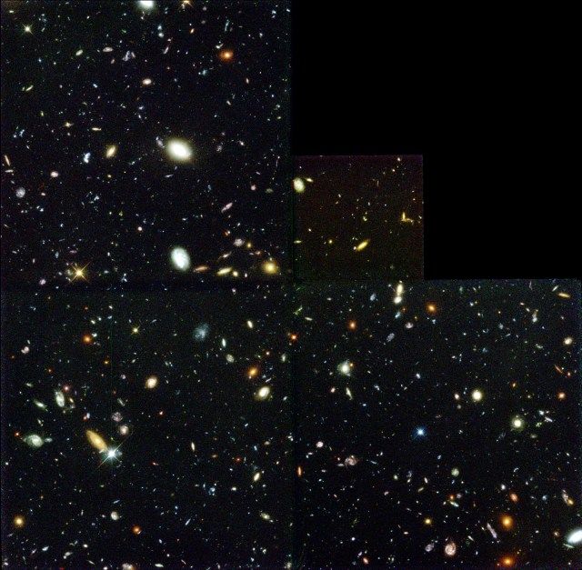Thousands of galaxies float in a small section of space.