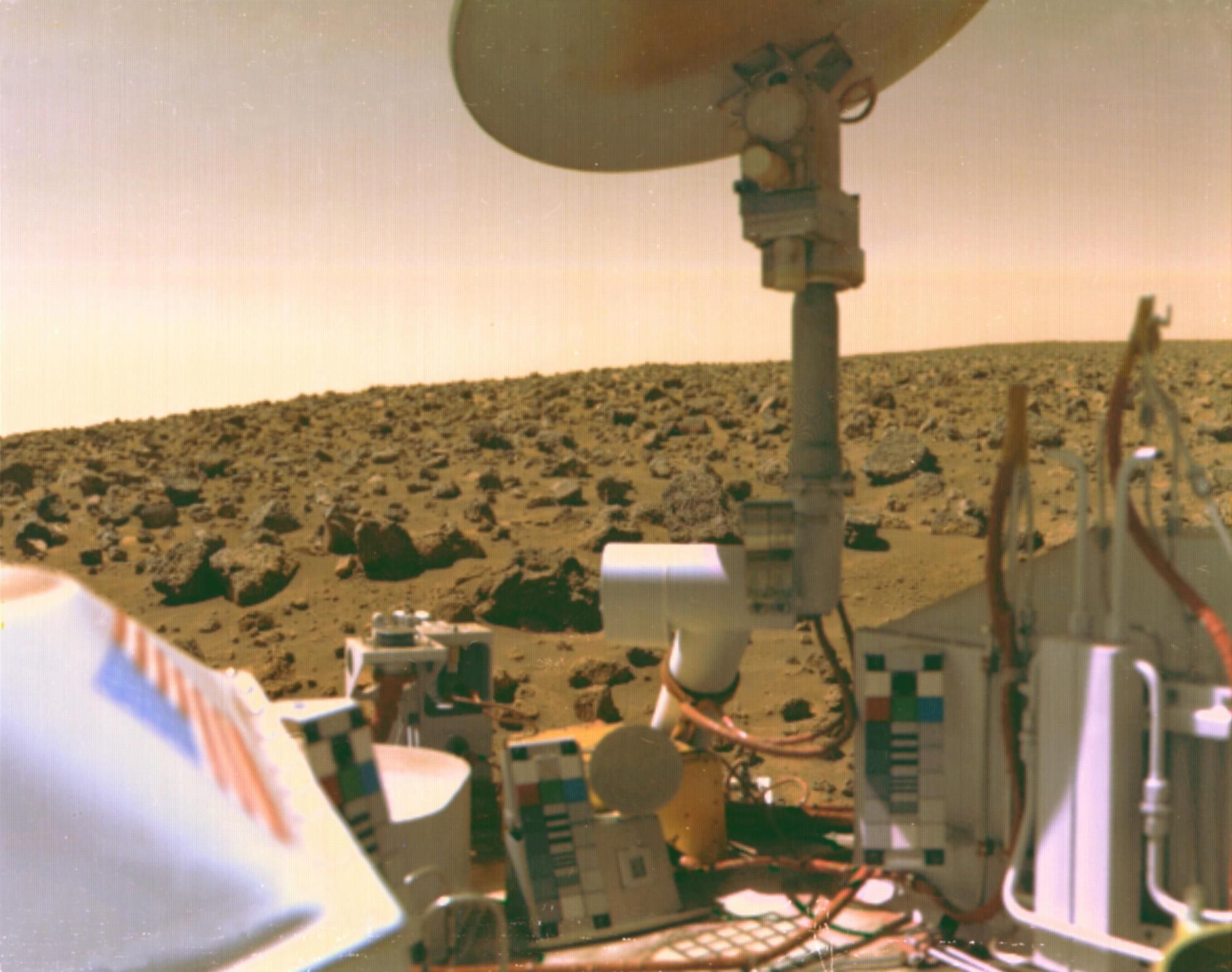 Part of Viking 2 seen with Martian boulder field in the background.
