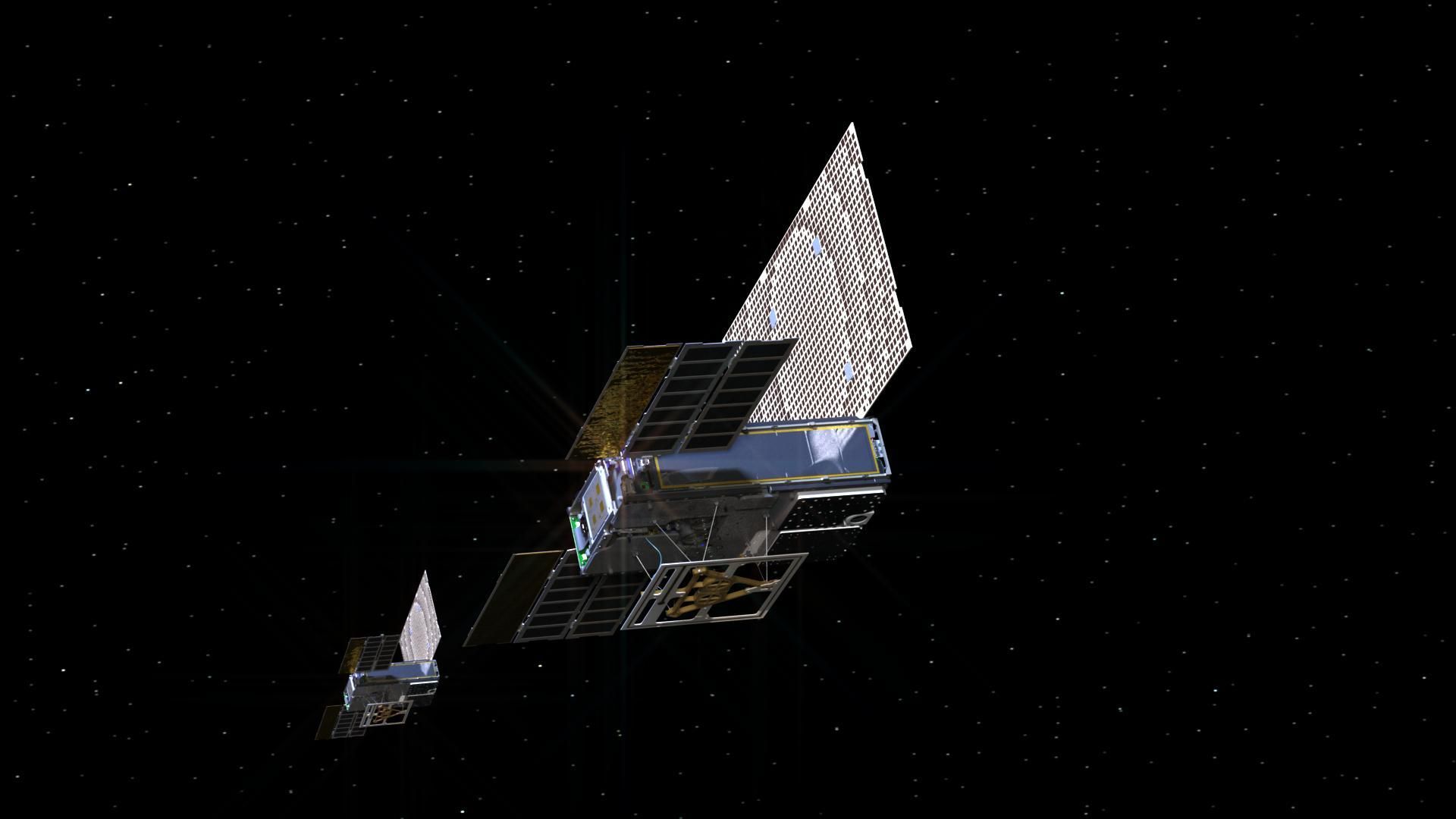 Twin small spacecraft in space.