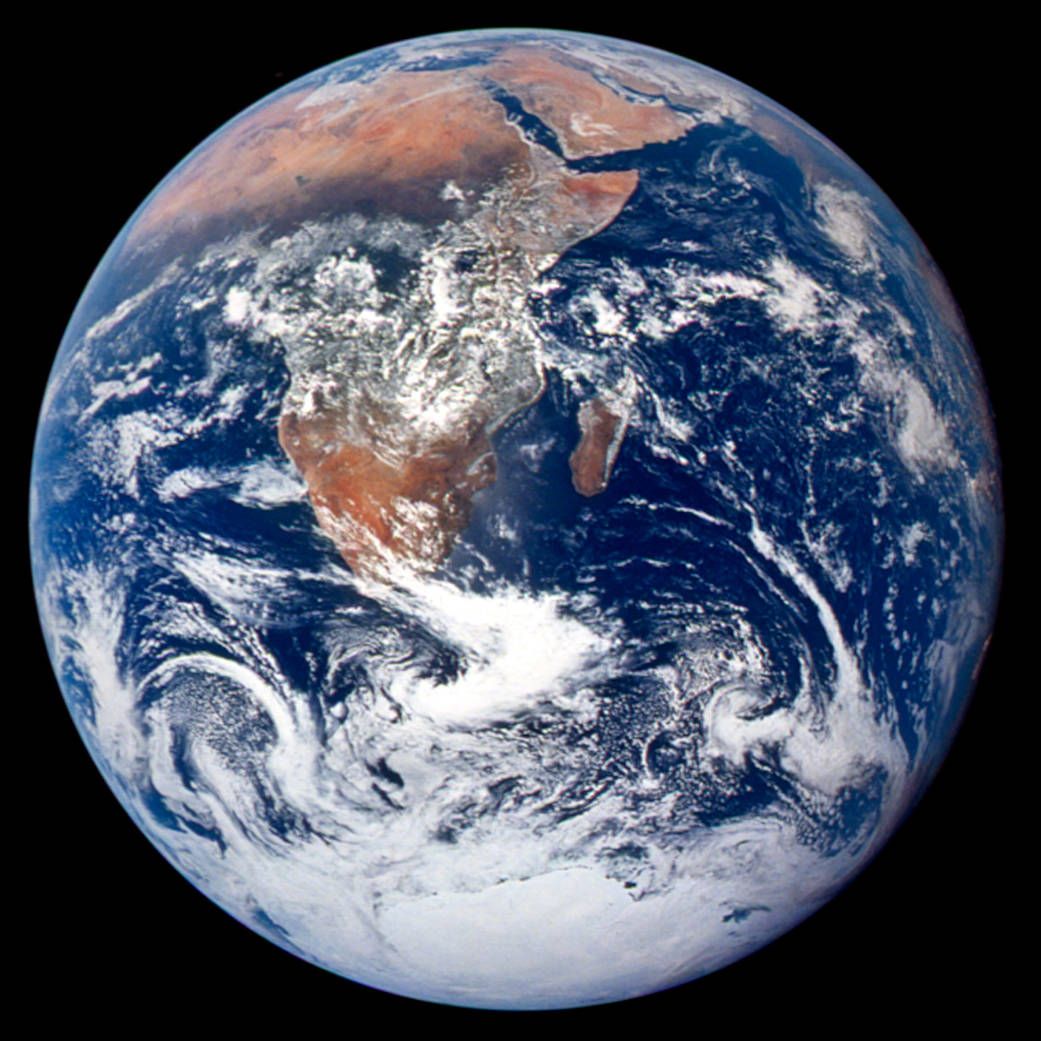 full-disc view of earth with continents and clouds visible