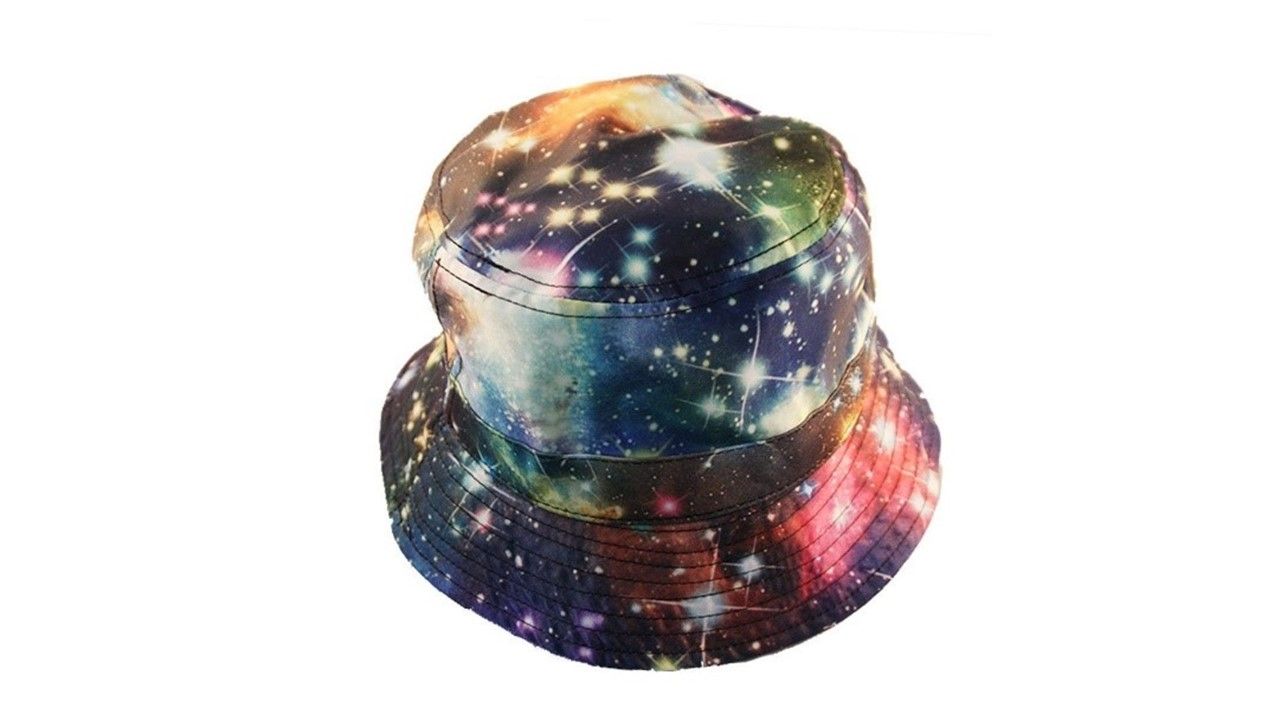 A bucket hat printed with stars and nebulae