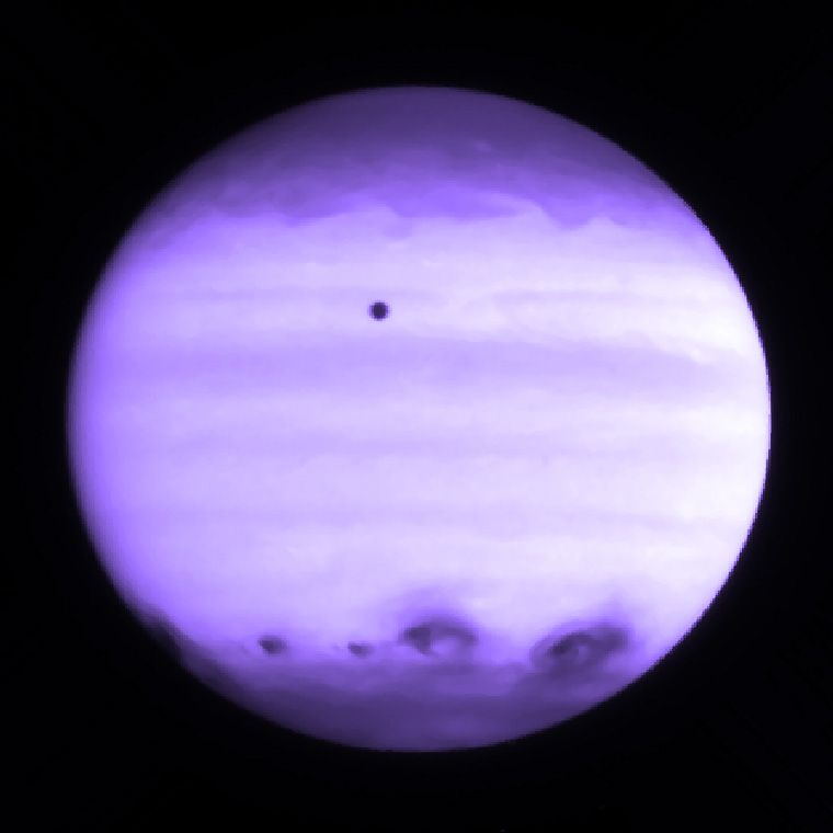 Enhanced view showing impact marks on Jupiter.
