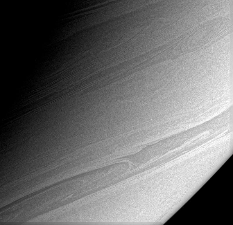 Long, thin streamers of cloud arc gracefully across this view of Saturn's southerly latitudes