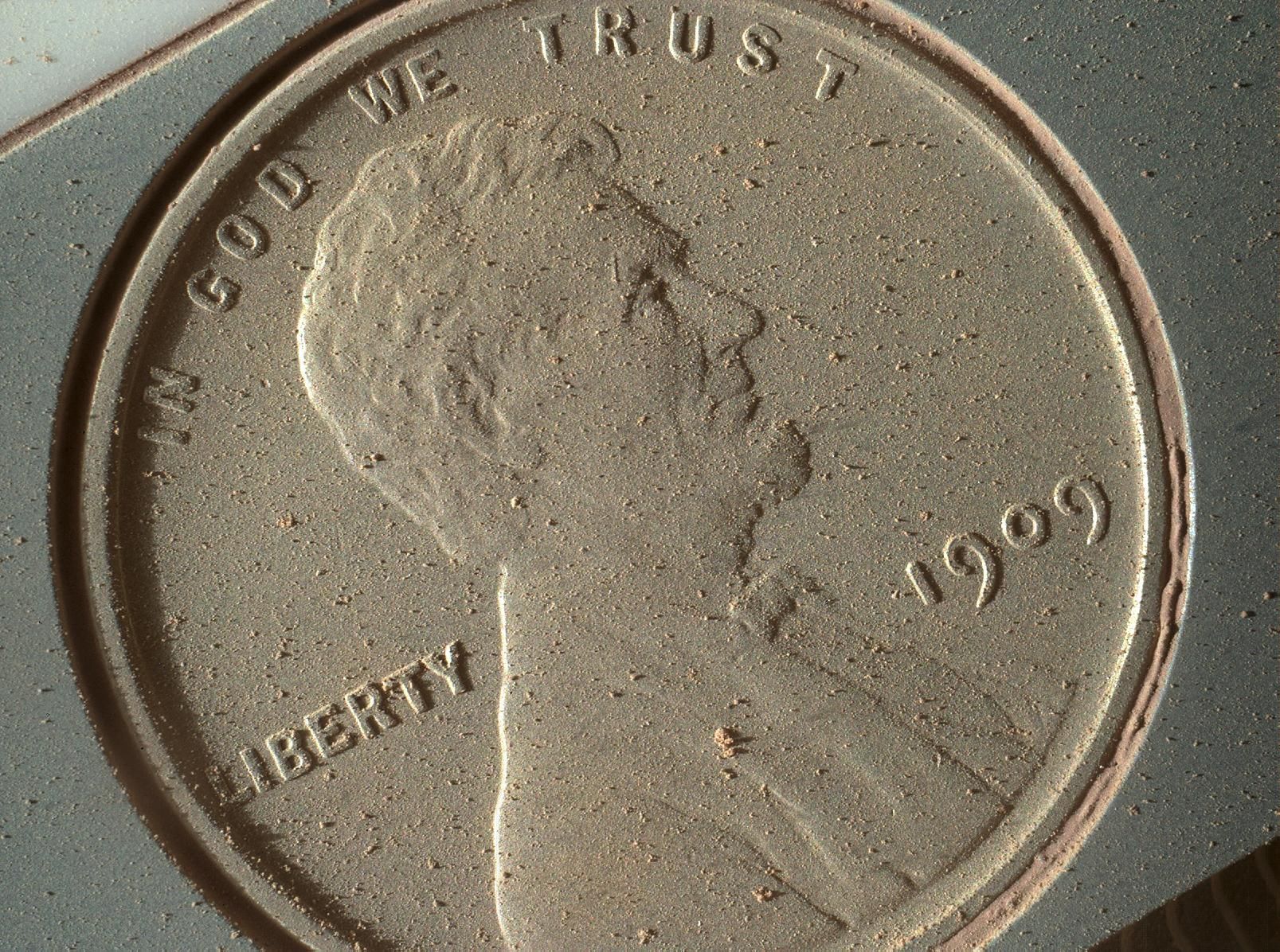 Penny covered with Martian dust.