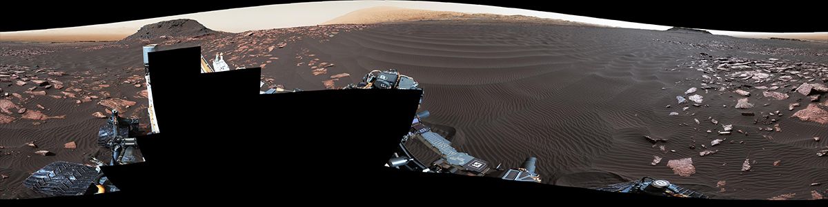 A rippled linear dune of dark Martian sand, "Nathan Bridges Dune," dominates this full-circle panorama from the Mast Camera (Mastcam) of NASA's Curiosity Mars rover.