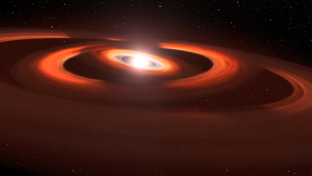 Artists concept: 3 concentric rings of dust and gas. At center: a glowing sphere. Reddish-colored rings inclined to each other due to gravity of unseen planets warping the disk, casting shadows across the outermost ring at 11 o'clock and 12 o'clock.