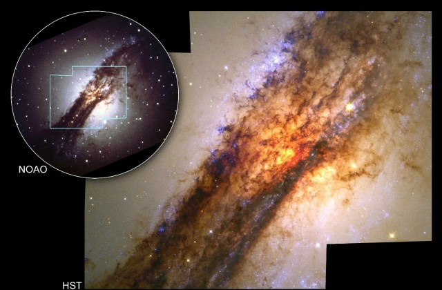 Upper-left corner: a ground-based image of the galaxy looks like a bright-white ball of stars with a dark dust lane through its middle. A box outlines the area Hubble image. The rest of the image holds Hubble's view. A dusty streak stretches from the upper-right corner to the lower left. A background yellow-orange glow cuts through the dust.