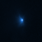 Three blue-hued, views from Hubble showing Didymos-Dimorphos asteroid system after DART impact. A bright, white-blue center and streaks of darker blue emanating outward, with the streaks growing in length across the three images.