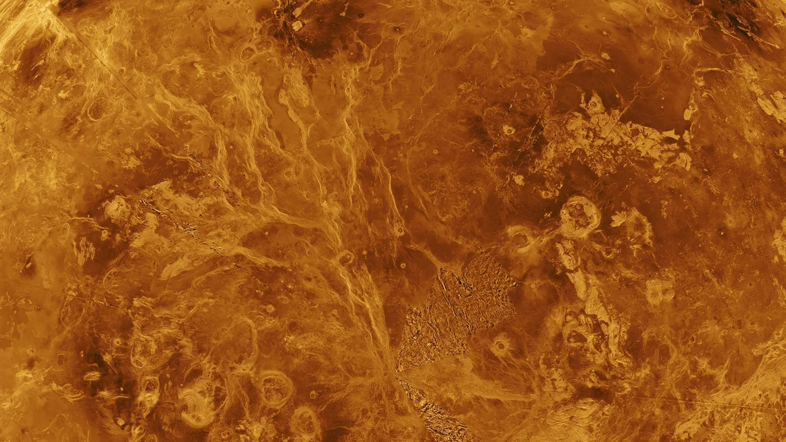 Close-up view of Venus showing a complex landscape of mountains, craters and lava flows.