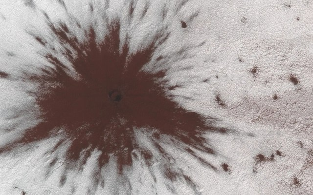Fresh impact crater on Mars.