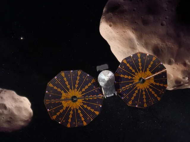 artist's illustration of Lucy and asteroids