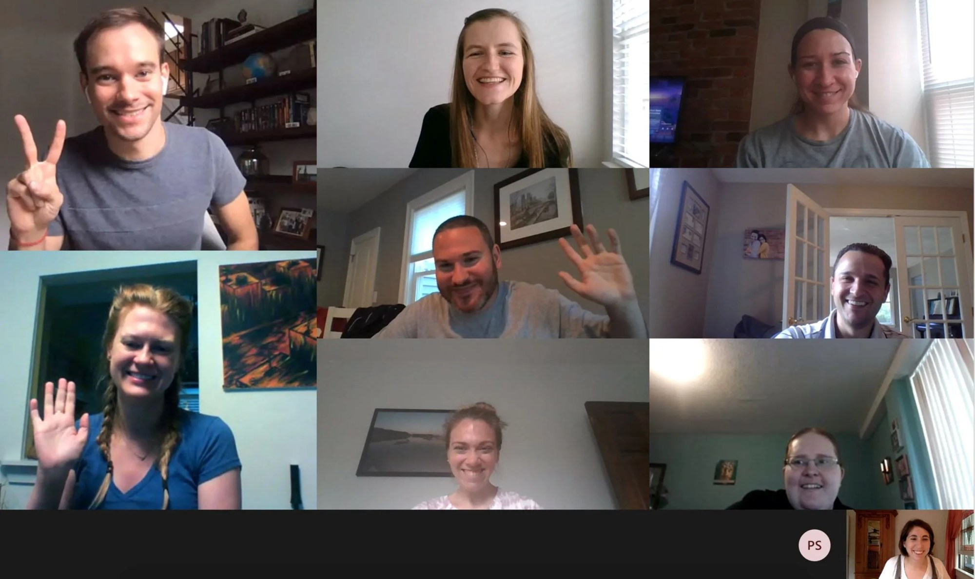 9 people smiling on a Zoom call.