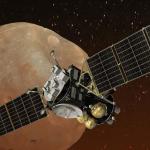 Spacecraft with extended solar panels in orbit over Mars