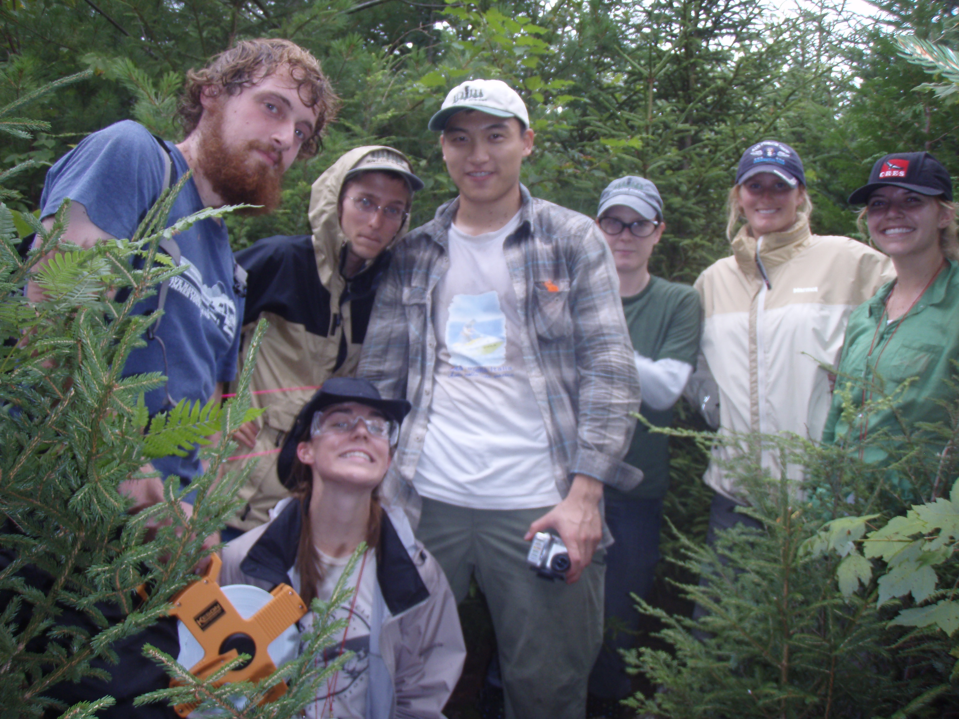 The Howland team demonstrating safety in science by wearing eye protection in dense forest.  From left: Chad Babcock, Will Broussard, Qiang Fu, Lisa Calhoon, Kelly Easterday.  In front: Corie Lahr. 