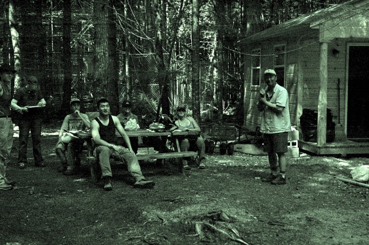 This photo of the Howland team at their cabin could almost be mistaken for mid 1800s logging camp, so little has changed. From left: Corie Lahr, Lisa Calhoun, Will Broussard, Qiang Fu, Chelsea Robinson, Kelly Easterday and John Lee. Photo by Sassan Saatchi.