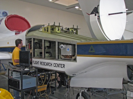 Dennis Pitts tinkers with wiring near the ozone instrument.
