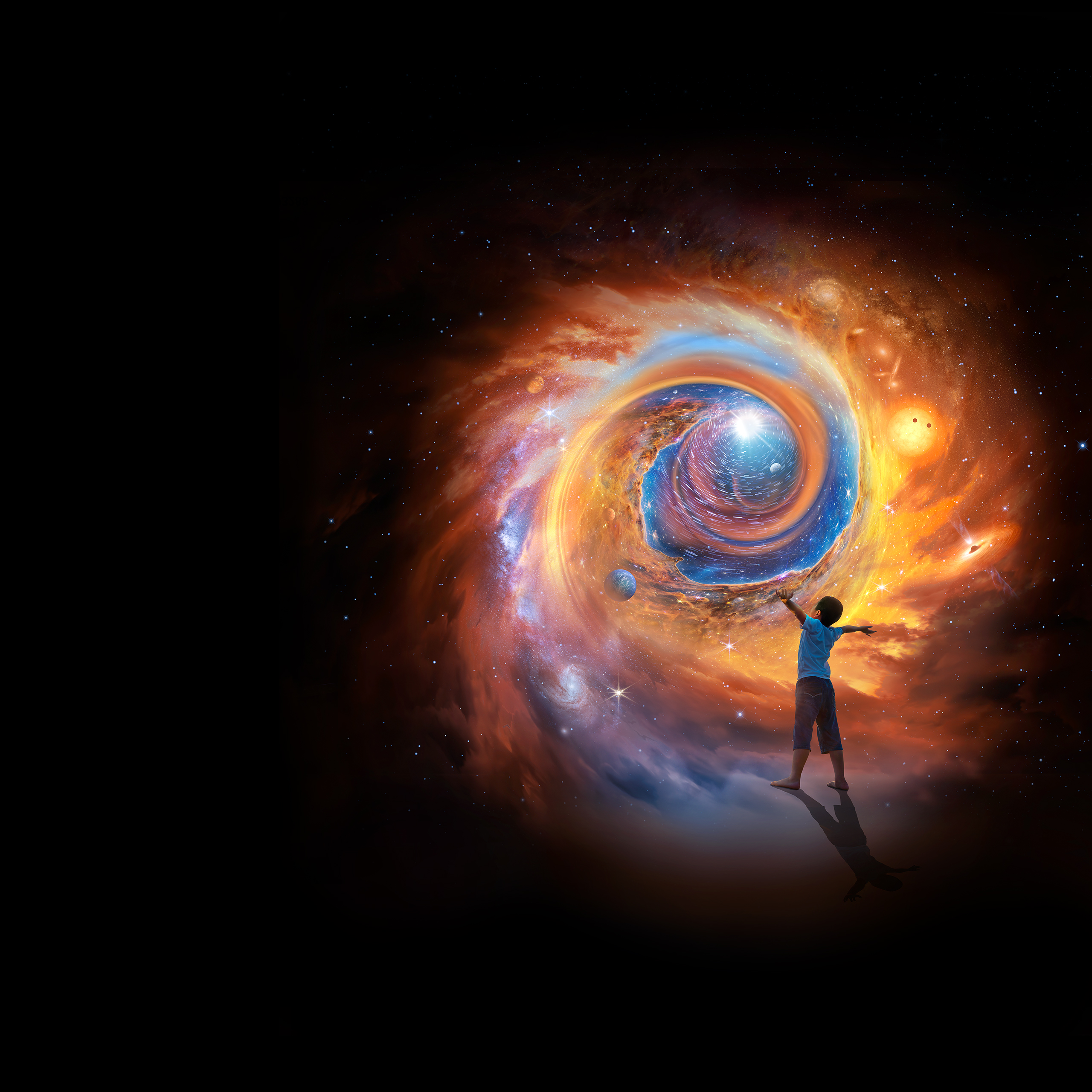 An artist’s concept – composed of reds, oranges, and blues accents – depicting swirling vortex of gasses, nebula, galaxies, stars, and exoplanets. These elements spiral inward toward a central glowing light. This light represents the origin of our Universe, or the “big bang.” The inner portion of the spiral was created from a section of the Carina Nebula, also known as the “Cosmic Cliffs,” captured by the Webb Space Telescope in 2022. A young boy stands at bottom right in the foreground with arm outstretched, and gazes up at the central light source.