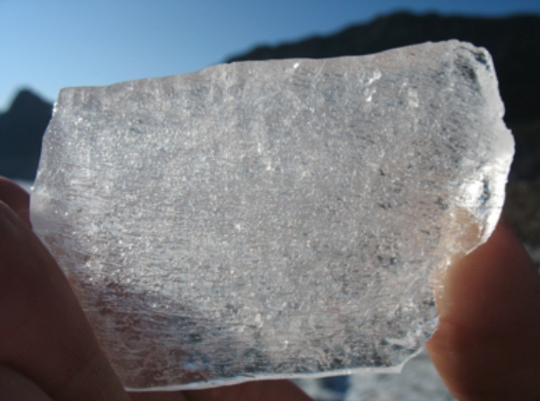 Piece of ice with bubbles inside. These bubbles provide information on the composition of the atmosphere at the time they were trapped in the ice.