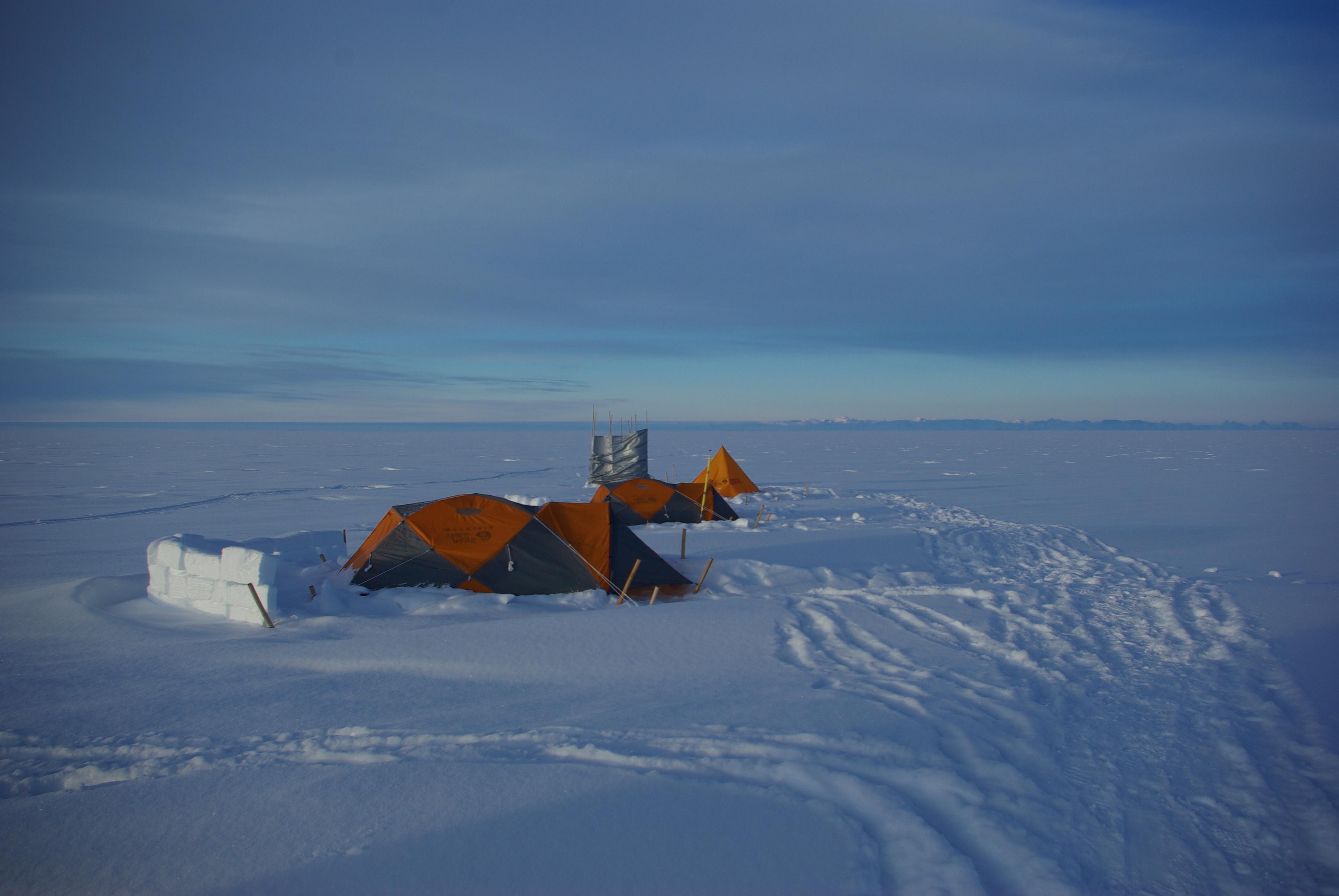 Mountain tents with walls.  The gray tarp is the wind break for the bathroom.