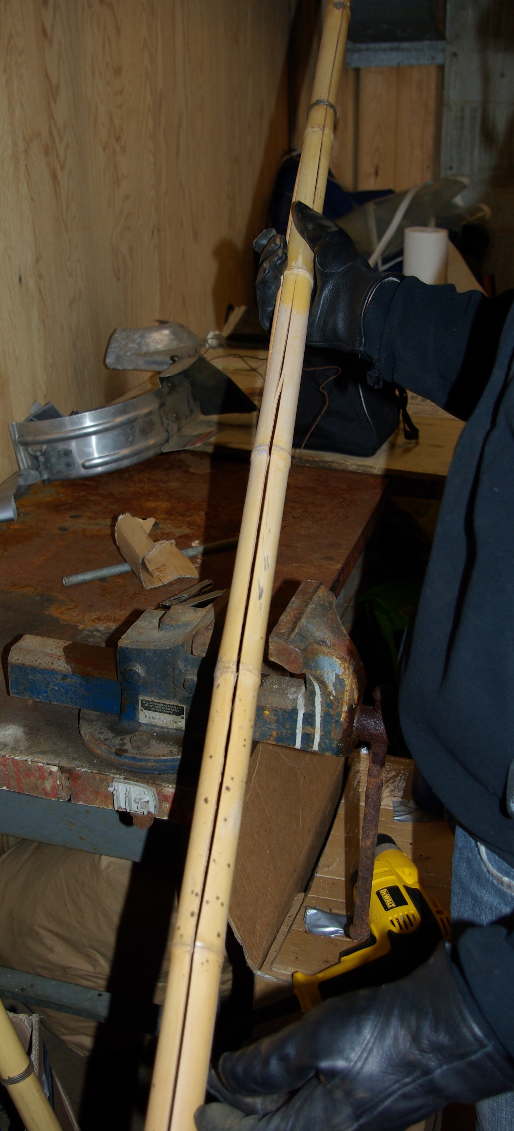 Working in the warehouse to improve the bamboo sticks that we'll use in the field as wind breaks.