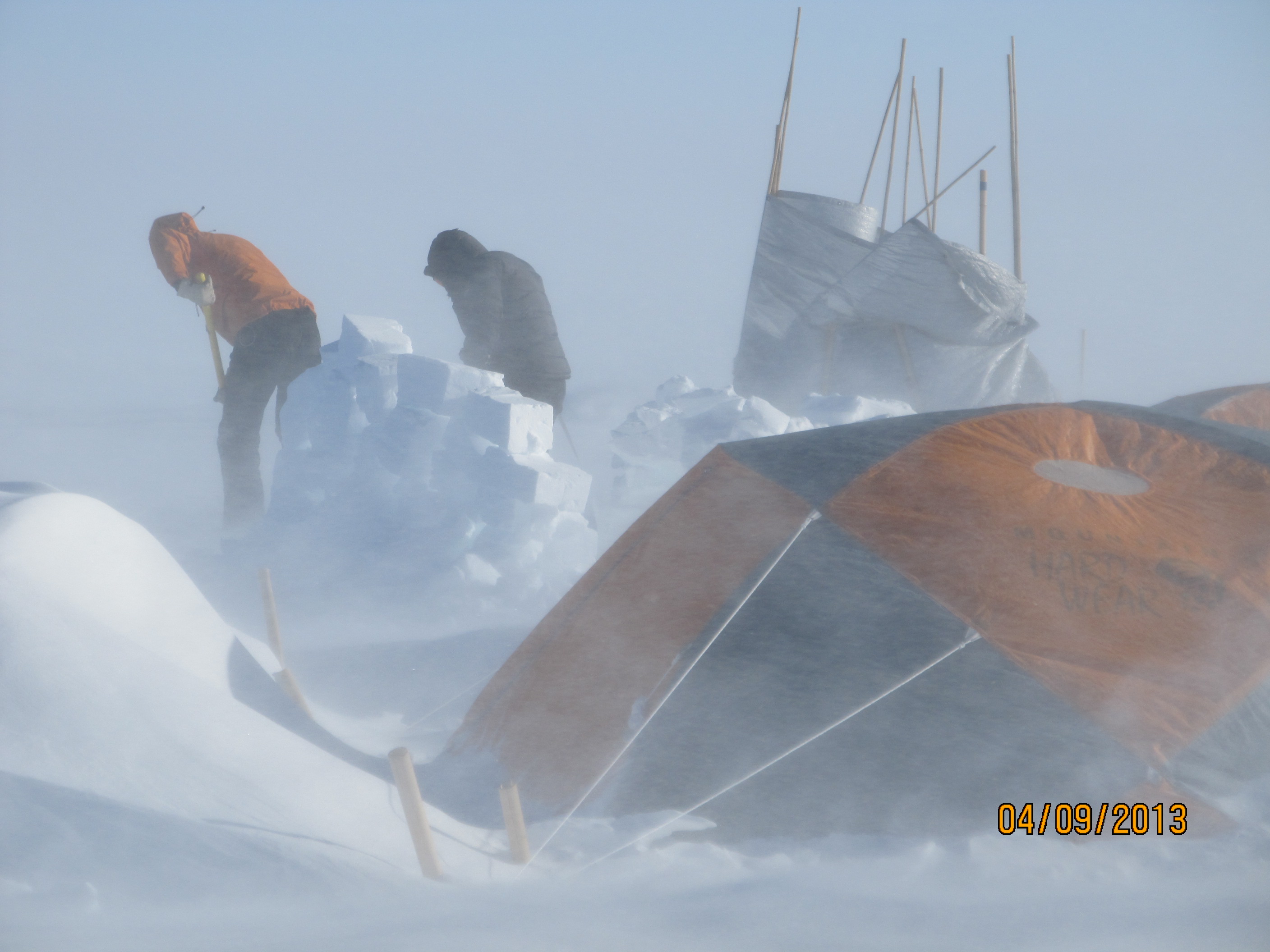 Ludo and Lora building a new wall for the mountain tent just before the winds stopped.