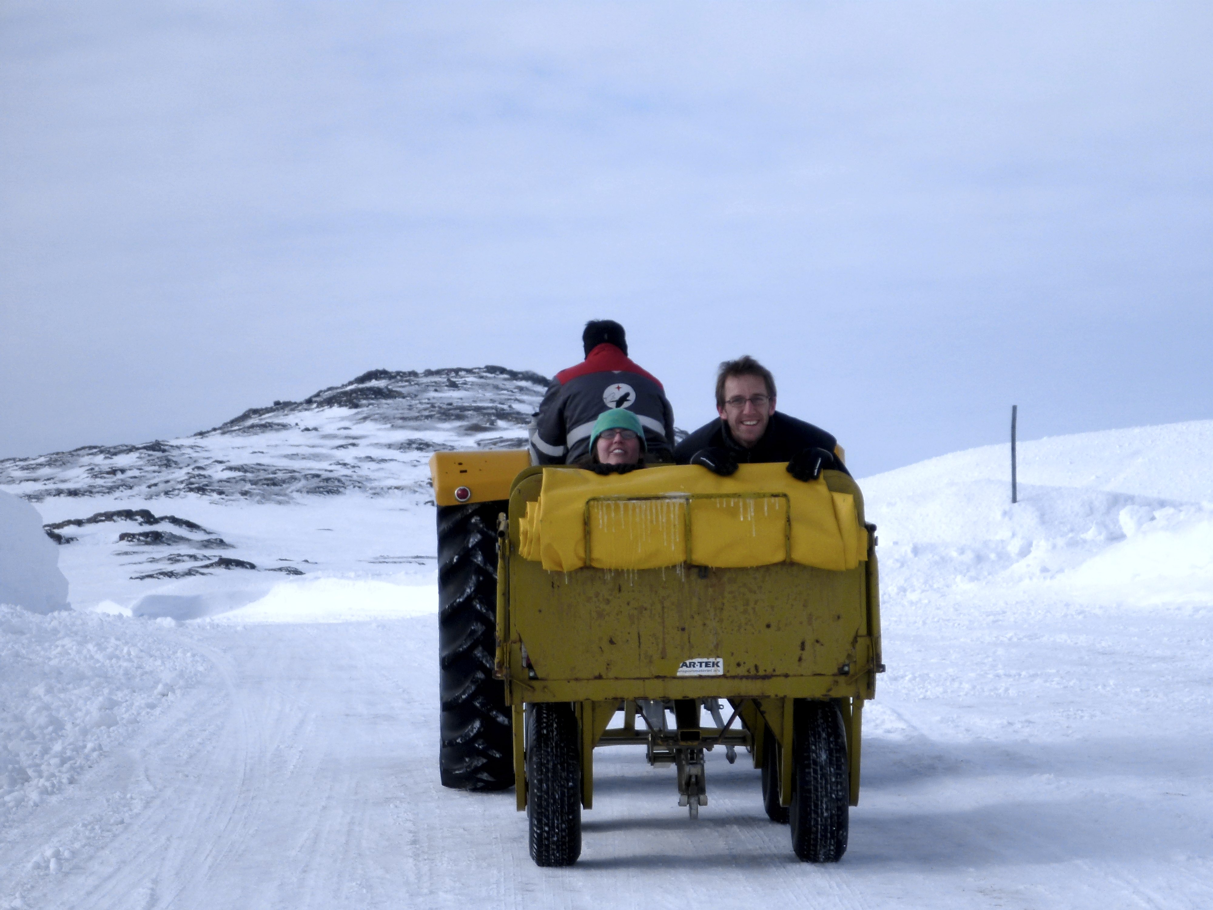 Catching a ride in the airport luggage carts.