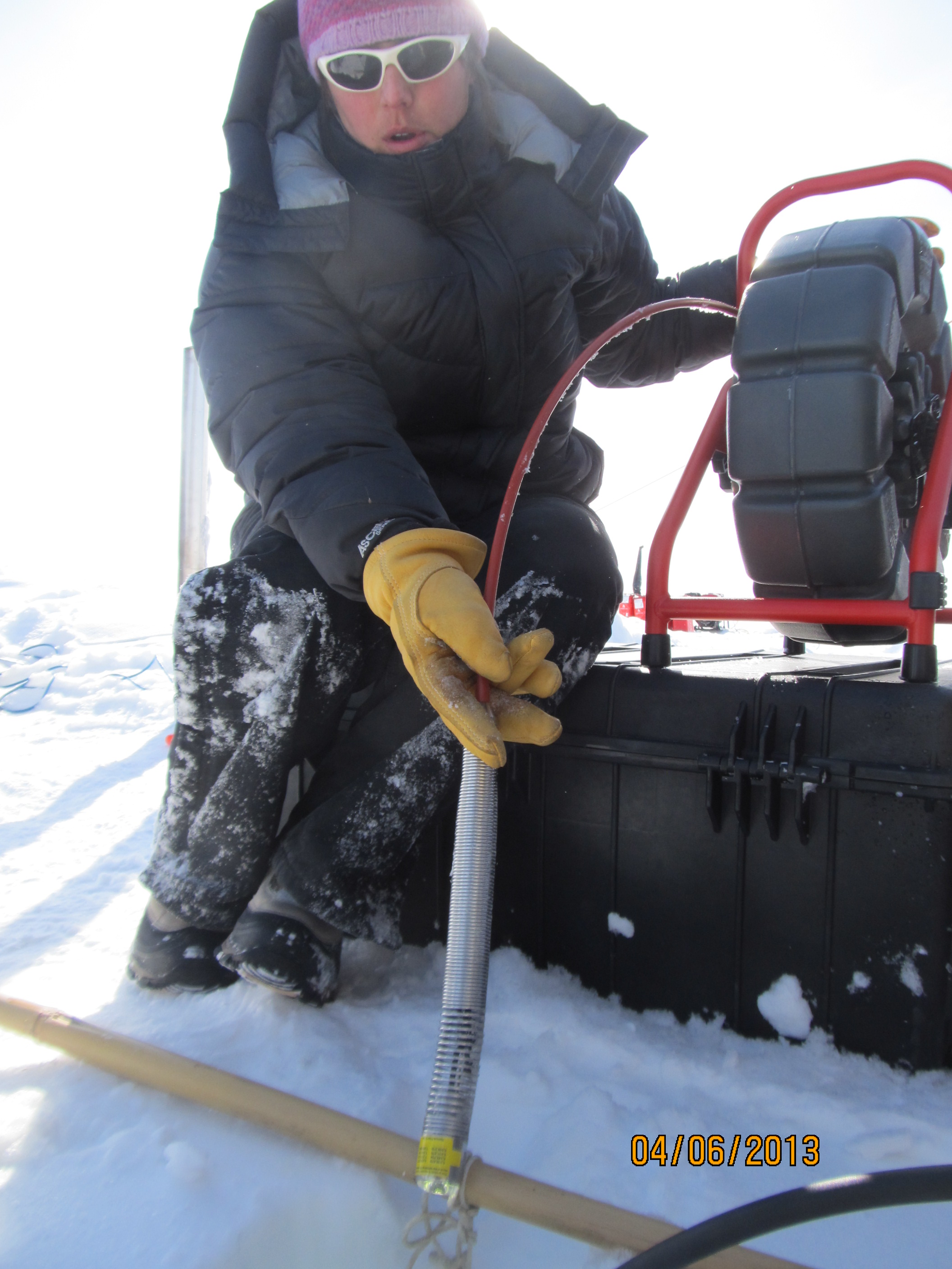 Lora holding the video camera that she will send down in the hole to monitor the snow and ice layering.
