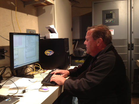 Dave Wolff is a radar scientist at NASA Wallops. He monitoring the radar data inside the science trailer on site at Traer, Iowa. Credit: Walt Petersen / NASA