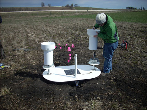 April 15, 2013. Kara Prior installs a rain gauge and soil moisture platform in the Turkey River basin in northeast Iowa. Credit: Iowa Flood Center