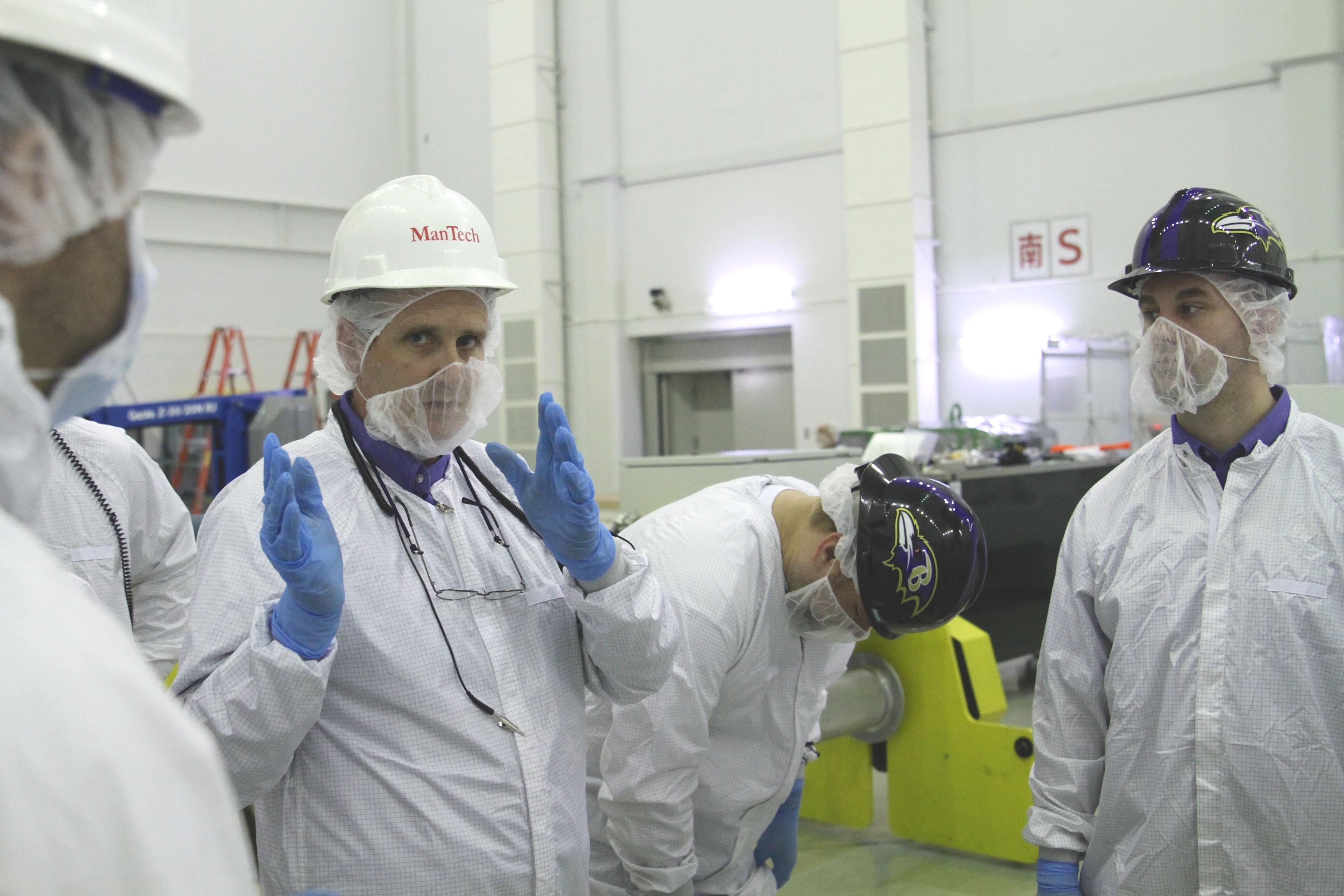 Mechanical team lead Jay Parker briefs his team on the upcoming lift of the GPM satellite. They're moving it from the L-frame that kept it safe during transport to the satellite support table that will allow them to rotate the spacecraft for inspection. Credit: NASA / Michael Starobin