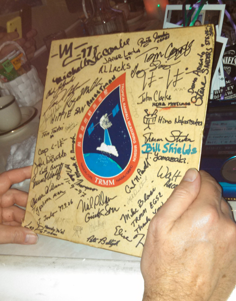 Emico's has been a popular for after-work karaoke since the Tropical Rainfall Measurement Mission launched from Tanegashima in 1997. Emico, the owner, has a TRMM sticker on a board that's signed by the TRMM team. She also has Polaroid photos of all her patrons over the years. Credit: NASA / Ellen Gray