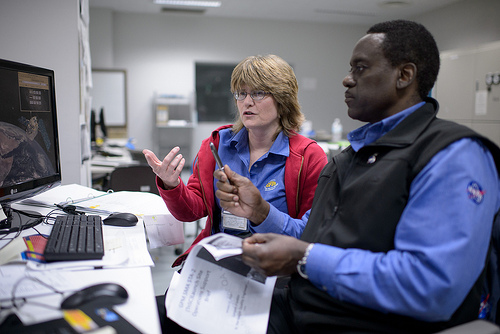 NASA GPM Safety Quality and Assurance, Shirley Dion, and, NASA GPM Quality and Assurance, Larry Morgan, monitor the all-day launch simulation for the Global Precipitation Measurement (GPM) Core Observatory at the Spacecraft Test and Assembly Building 2 (STA2), Saturday, Feb. 22, 2014, Tanegashima Space Center (TNSC), Tanegashima Island, Japan. Photo Credit: (NASA/Bill Ingalls)