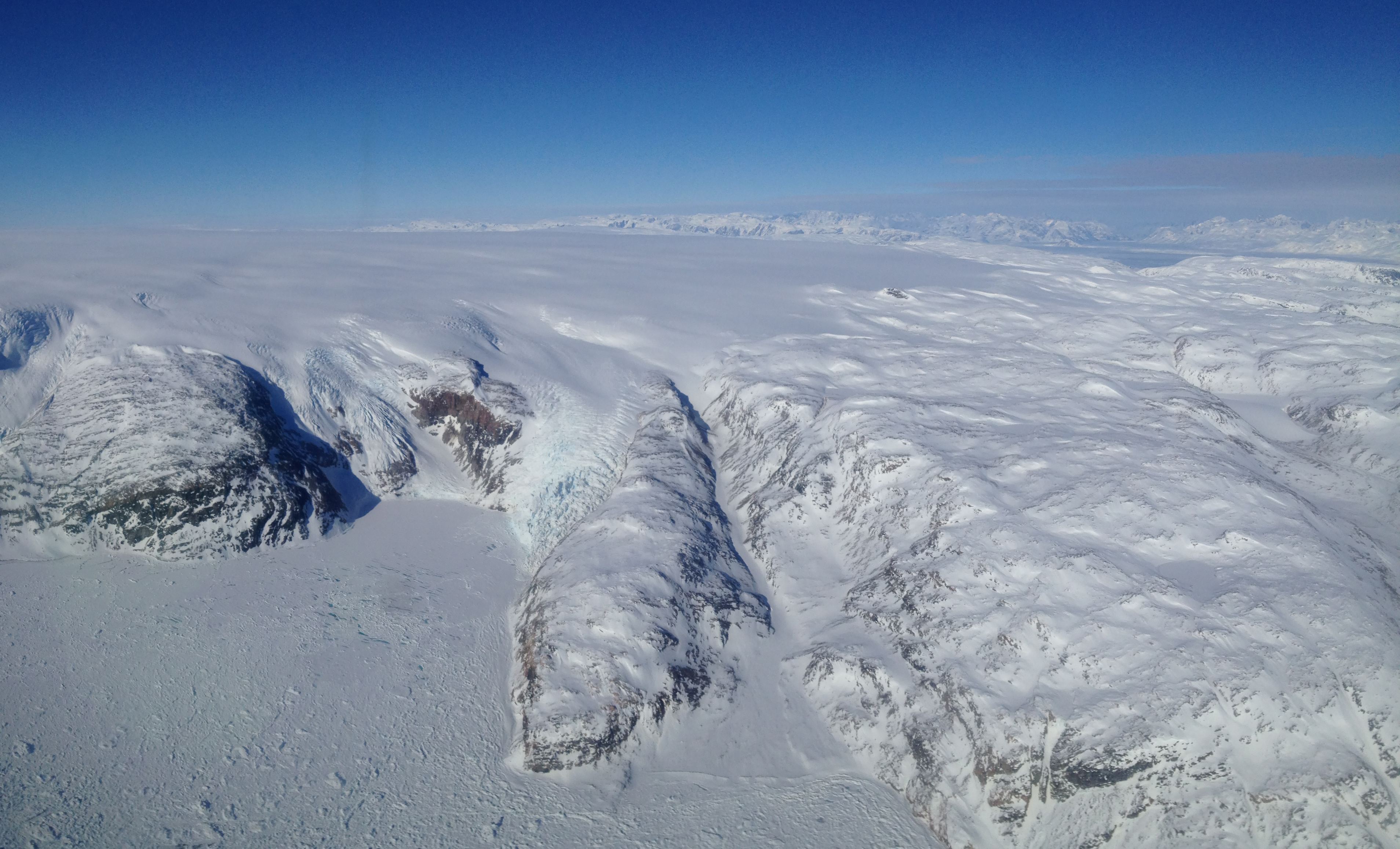 Flying over the sea-ice covered Sermilik fjord to reach the ice sheet.