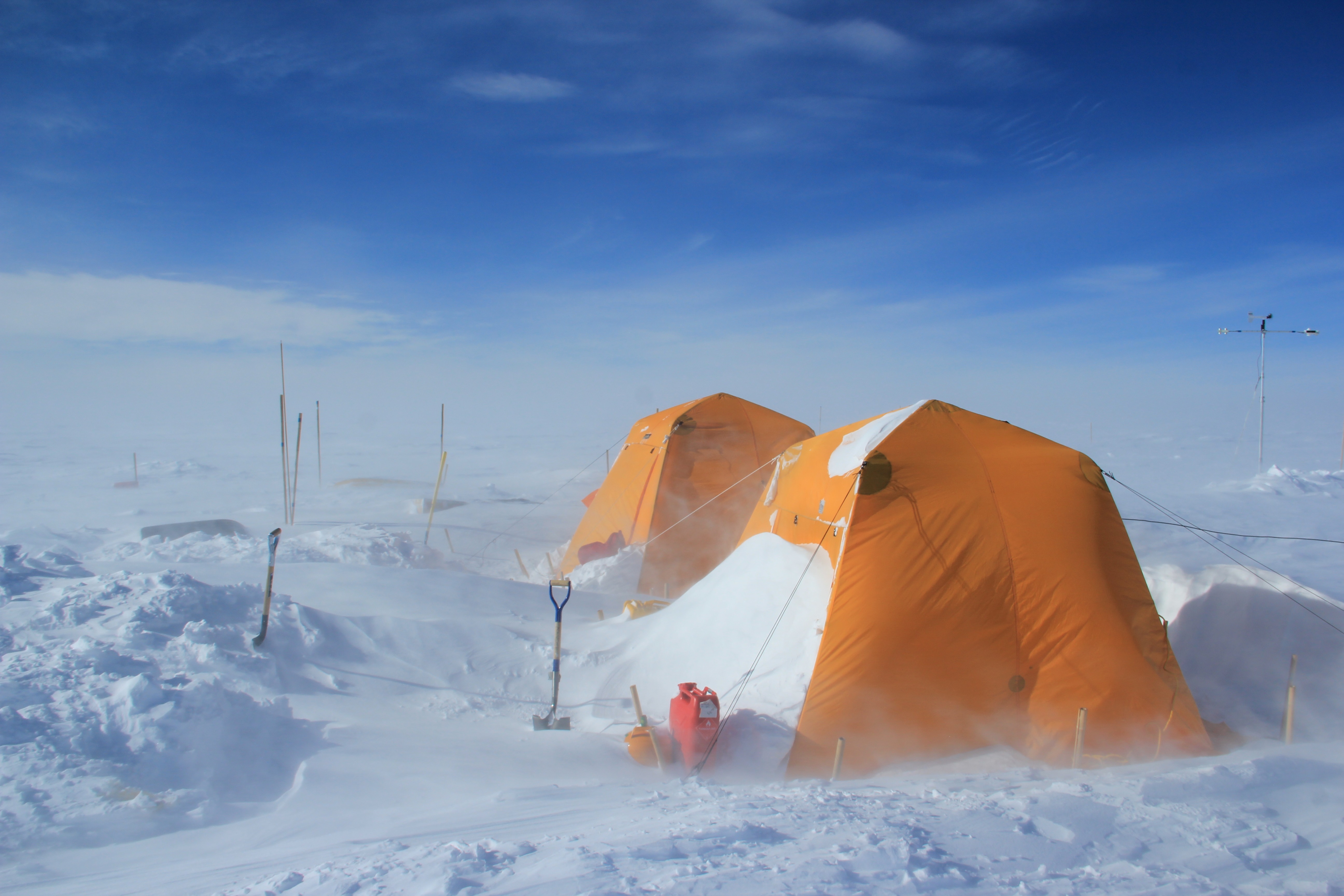 A snow drift blocking the door of the kitchen tent.