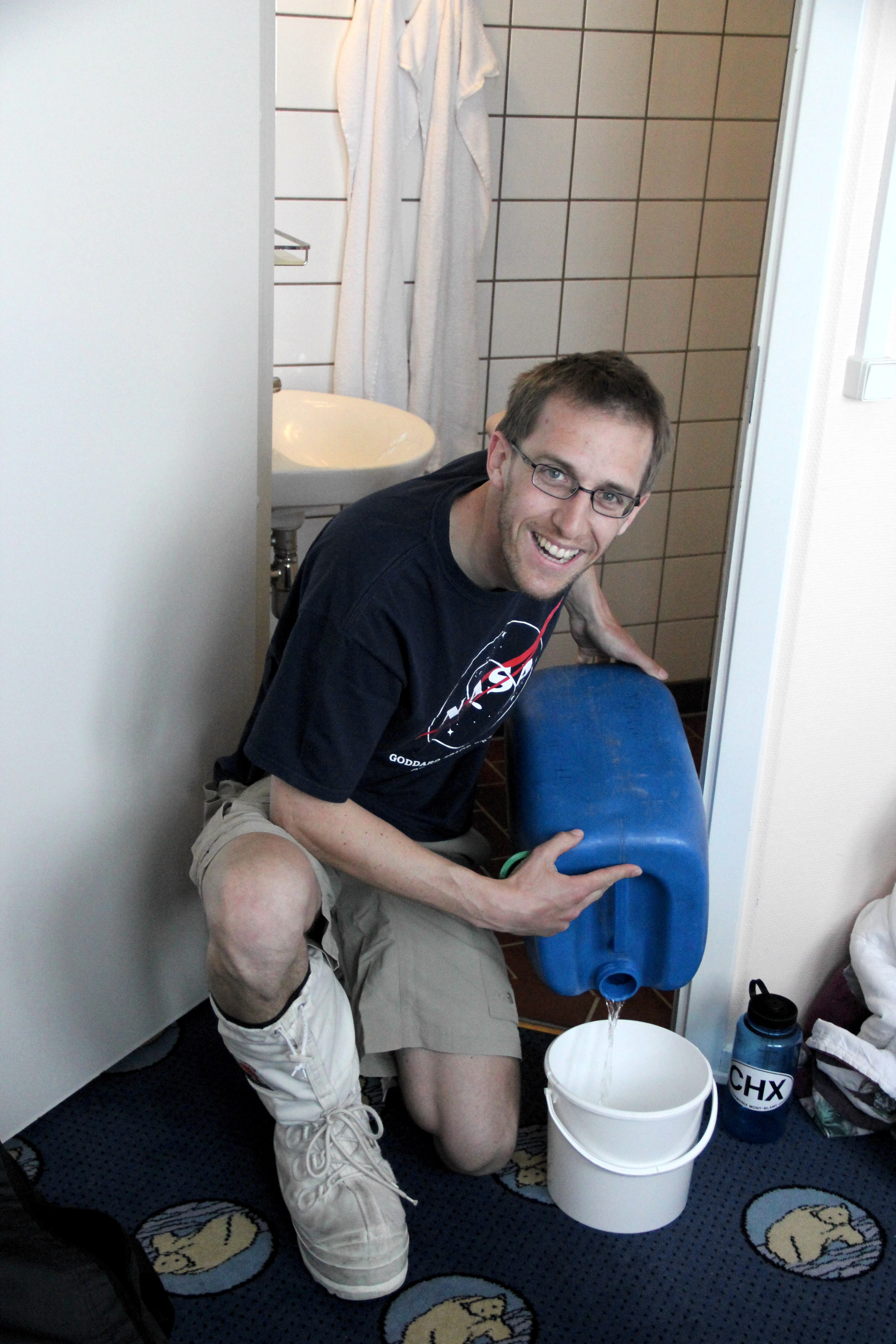 Getting ready for a last shower before departing.