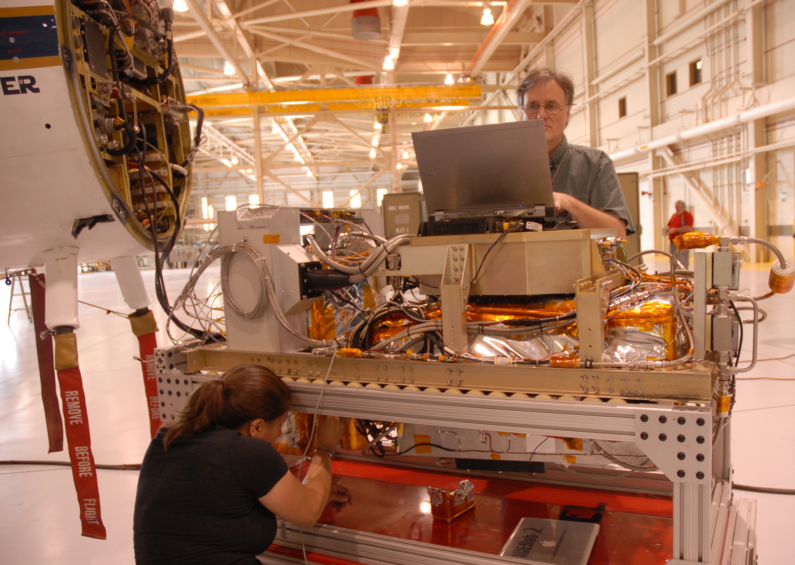MABEL engineer Eugenia DeMarco and programmer Dan Reed work on improving the new camera system for the instrument. (Credit: Kate Ramsayer/NASA)