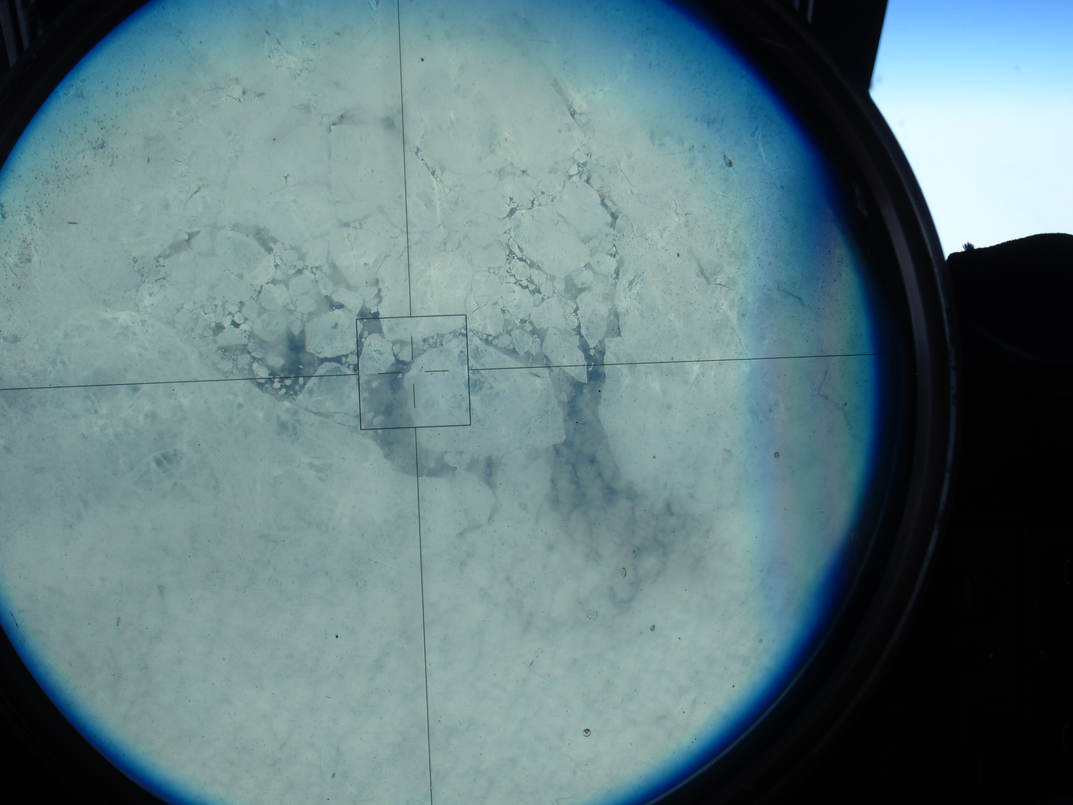 Sea ice, as seen through the ER-2's viewsight, on the 150 degree latitude line north of Alaska. (Credit: Tim Williams/NASA)