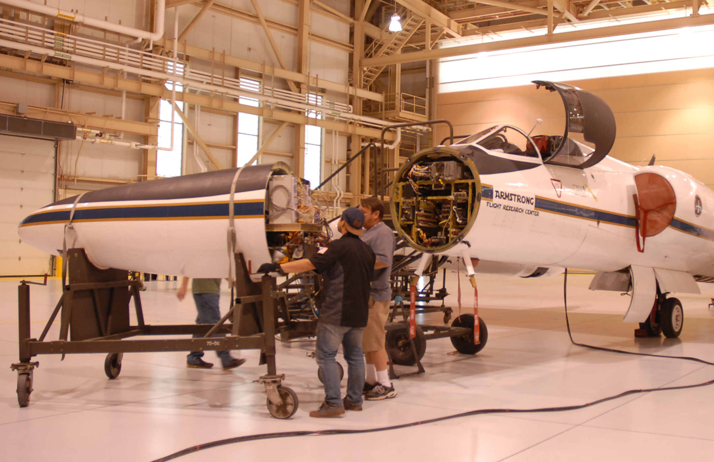 The ER-2 crew rolls the aircraft's nose -- containing MABEL -- away from its body, so engineers could work on the instrument. (Credit: Kate Ramsayer)