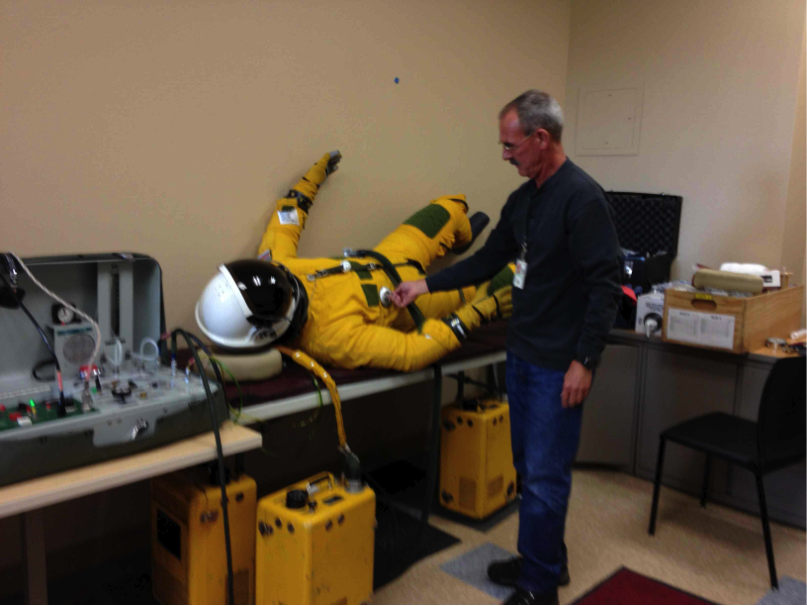 Engineer Technician Ryan Ragsdale of NASA Dryden inflates the pressure suit the day before to make sure there are no leaks. (No, there is not a real person in there!). (Credit: Valerie Casasanto/NASA)