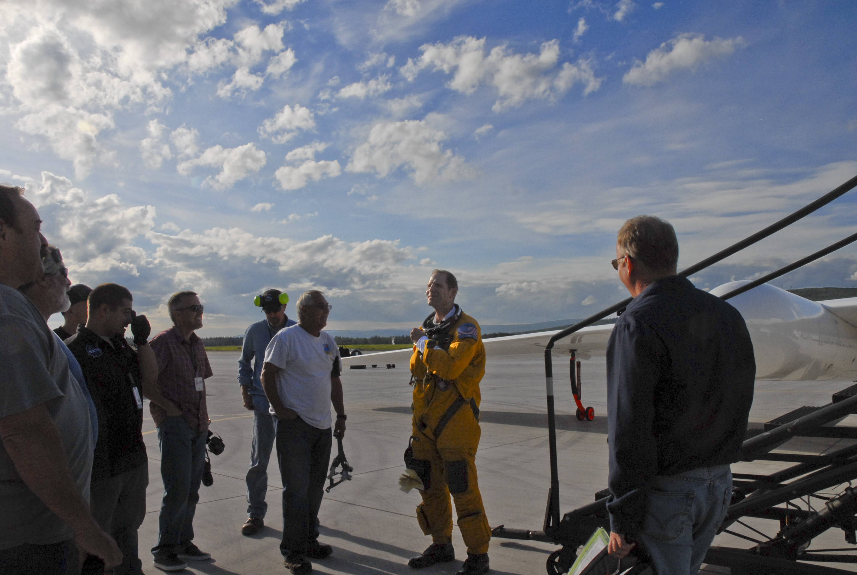 After flying to 60,000 feet above the North Pole and back, NASA pilot Tim Williams talks with the ER-2 crew about what happens to flight instruments when you reach 90 degrees north. (Credit: Kate Ramsayer/NASA)