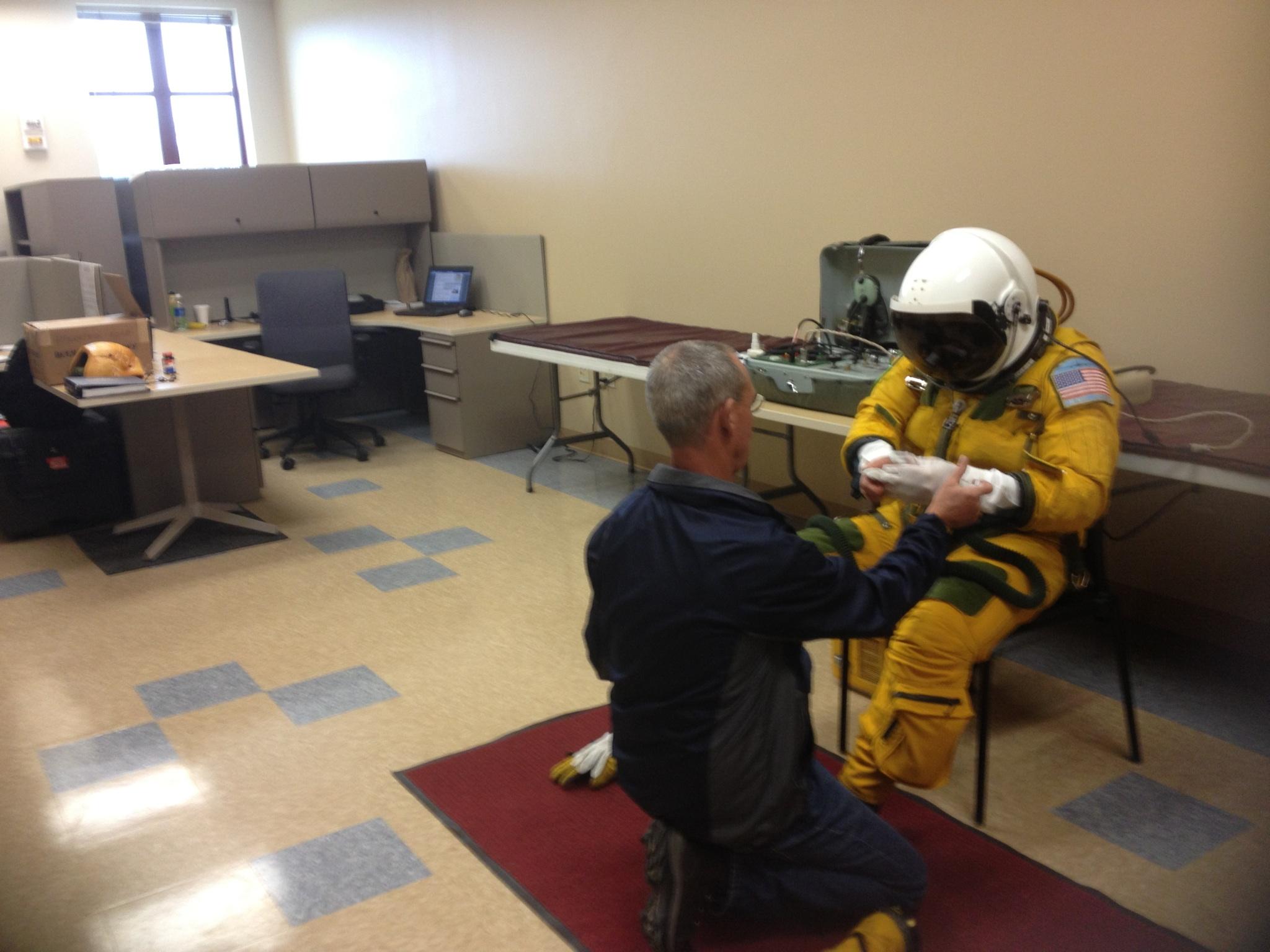 ER-2 pilot Denis Steele puts on a pressurized suit before the flight, which will take him to 65,000 feet. (Credit: Valerie Casasanto/NASA)