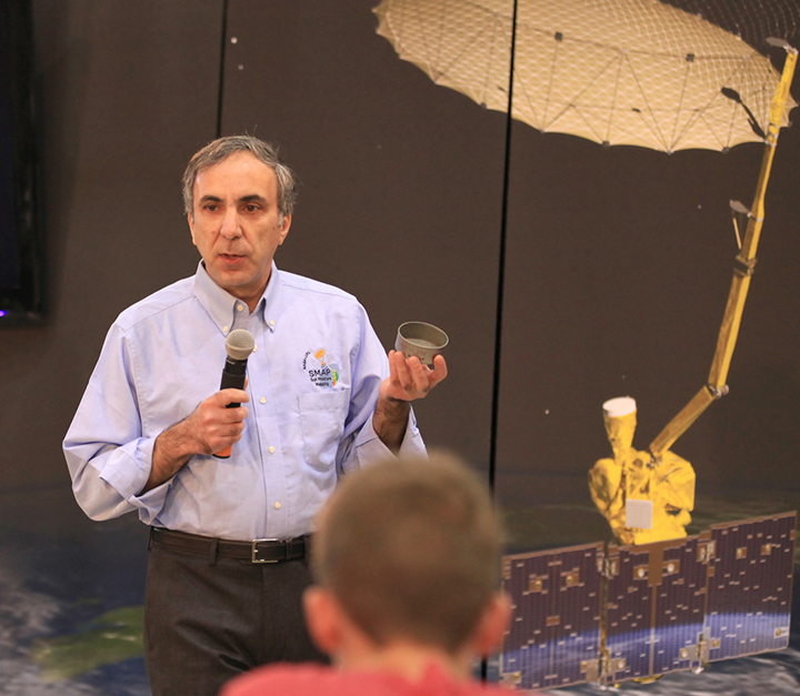 Science team leader Dara Entekhabi discusses the science and engineering of NASA's Soil Moisture Active Passive (SMAP) mission with the audience of a NASA Social held on January 28, 2015, at Vandenberg Air Force Base in California. Credit: NASA