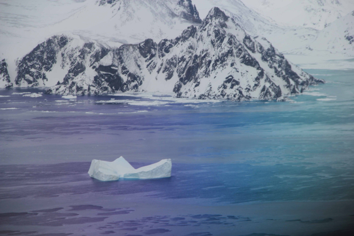 Amazing view from the plane of an iceberg.