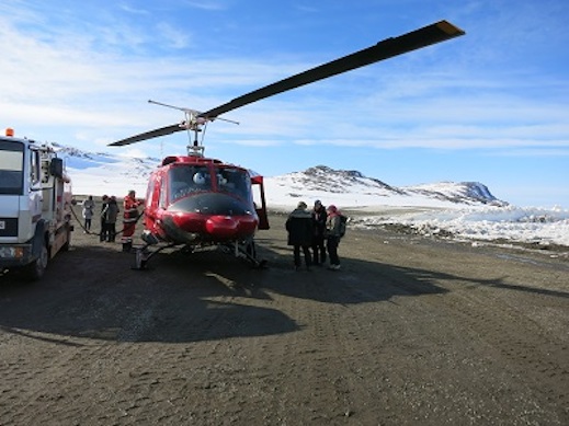 Fueling up the Bell 212 and giving Lora giving last minute advice.