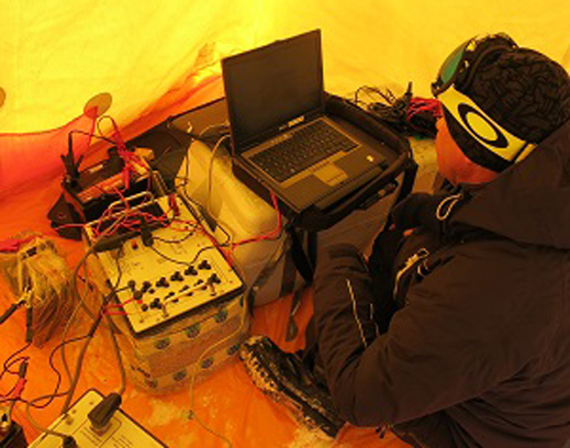 Anatoly taking magnetic resonance measurements.