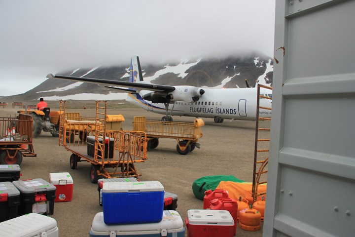 Camp gear at Kulusuk Airport being organized for helo flight into the field.